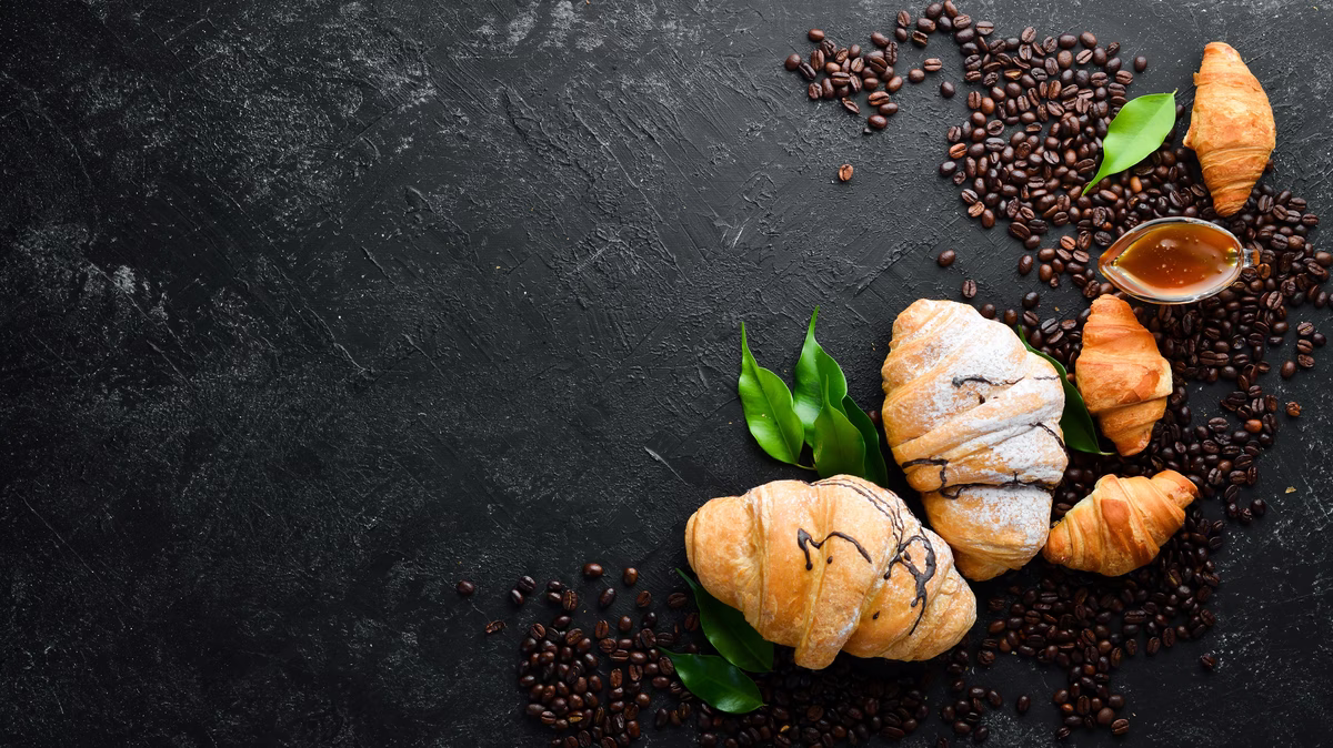 breakfast-fresh-chocolate-croissant-black-stone-background-top-view-free-space-your-text-min