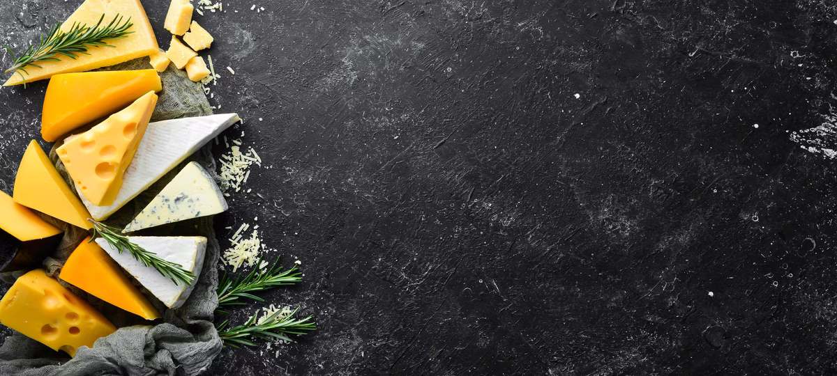 cheese-assortment-cheese-snacks-black-stone-background-top-view-free-space-your-text-min